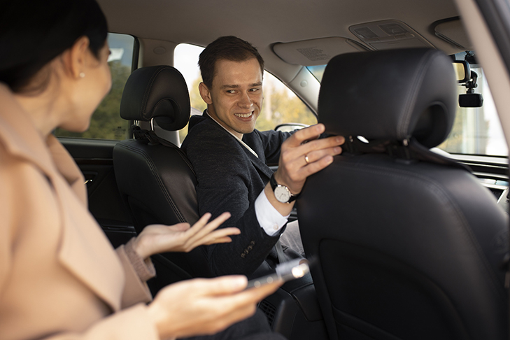 woman-talking-with-taxi-driver-car.jpg